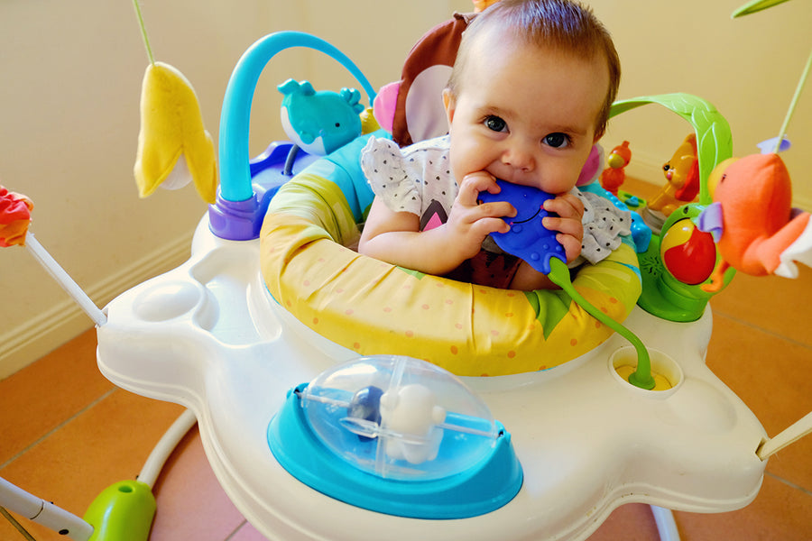 baby in an activity center