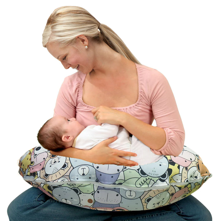 Nursing mom with baby on pillow