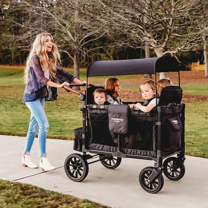 Mom pushing kids in wagon