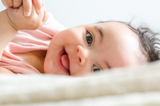 Smiling baby staring into camera