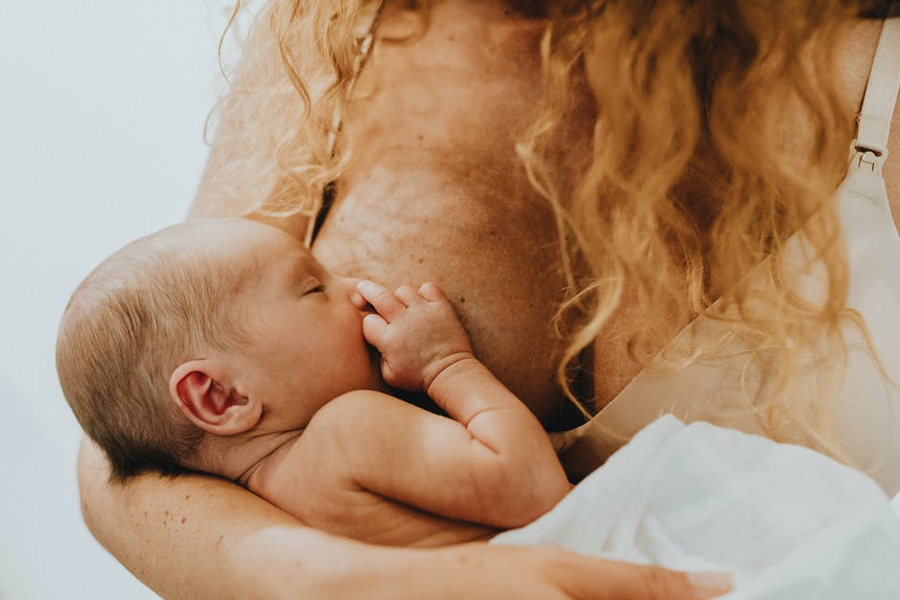  A woman breastfeeding her baby.