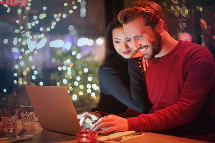  a couple looking up baby registries online