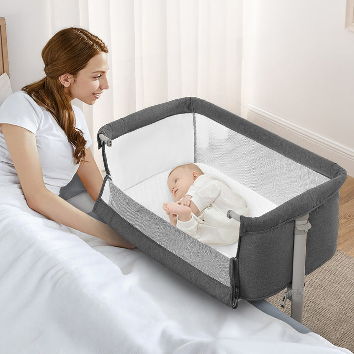 Baby in bassinet with mom