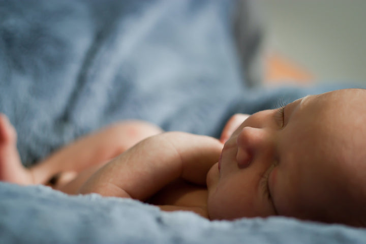 Close-up Photo of Baby in a Blue Blanket