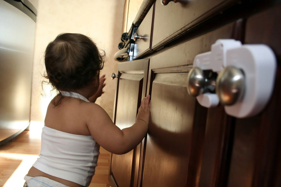 Child with childproof cabinets