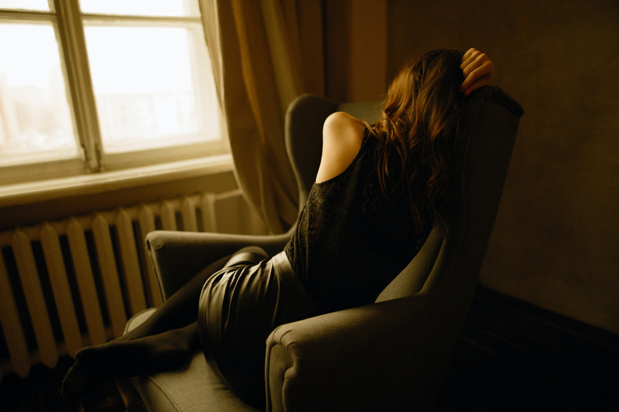 depressed woman in a dark room