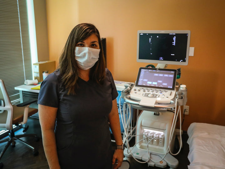  nurse next to ultrasound machine