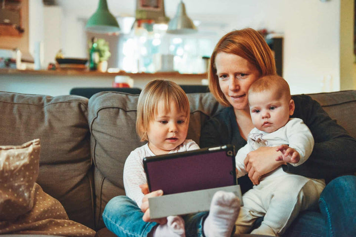 baby playing on a tablet