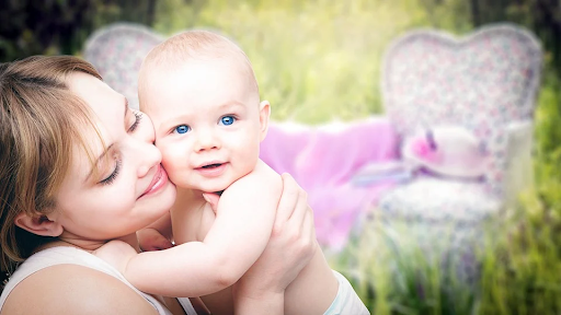 mother holding baby