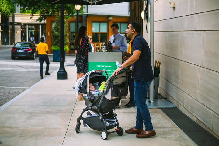 Man holding a baby stroller
