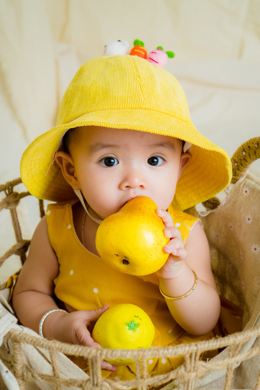 Baby in yellow hat
