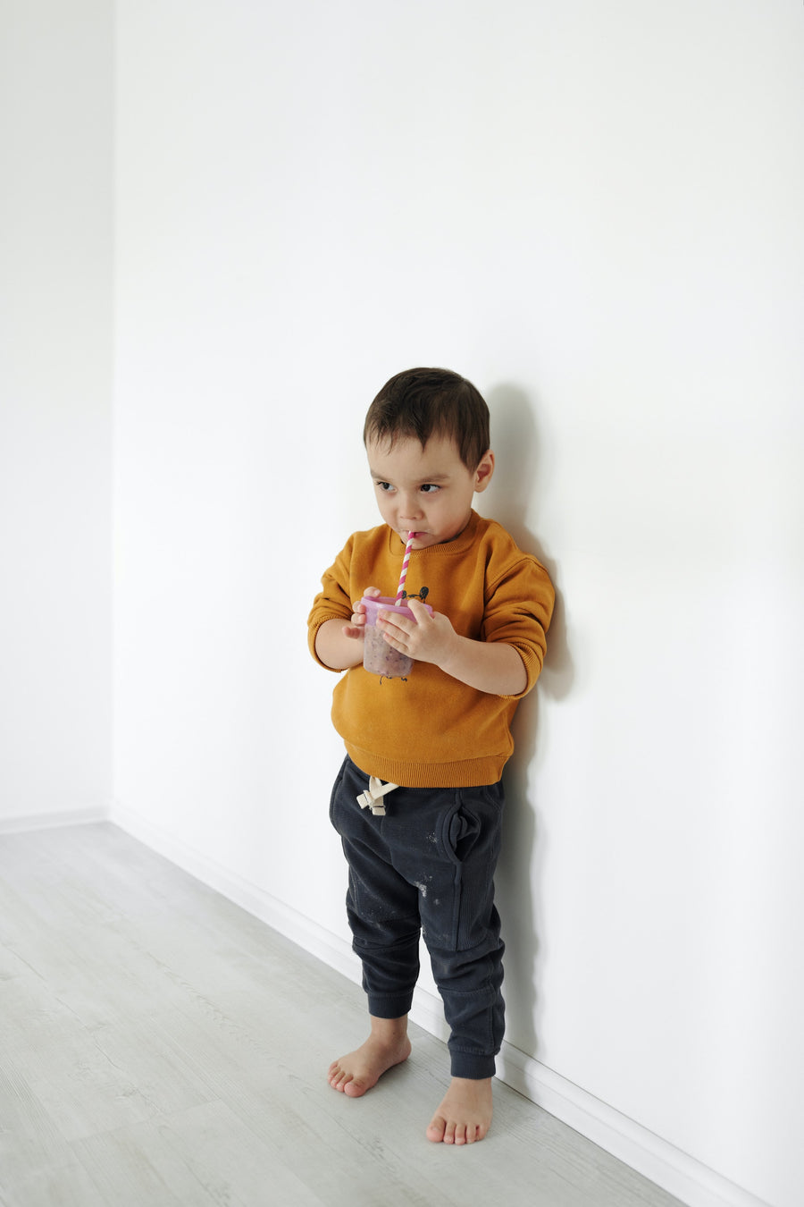 baby drinking from a sippy cup