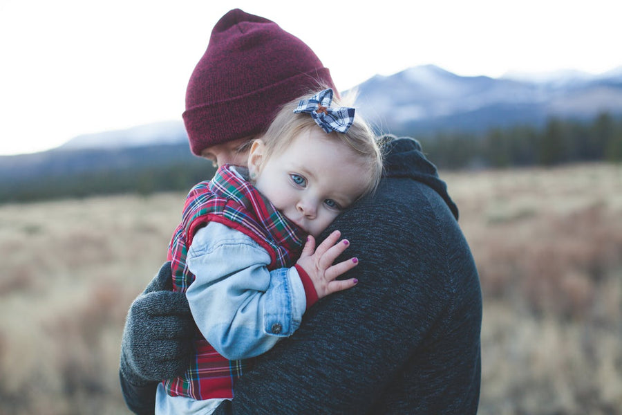 father hugging his daughter