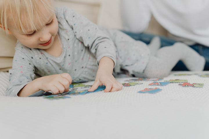  Toddler playing with puzzle  Image Source