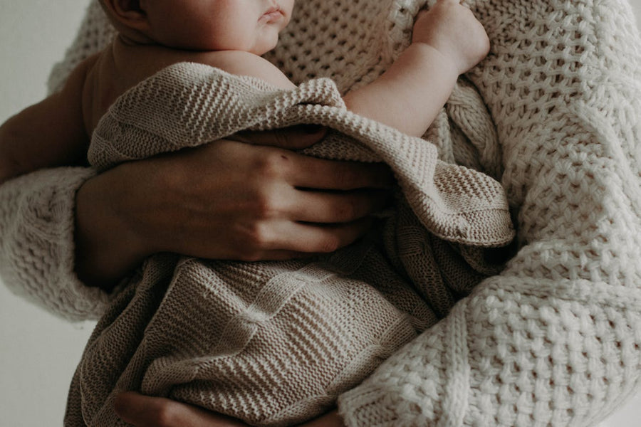 mom holding baby