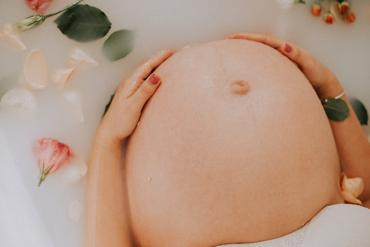  pregnant woman taking a bath