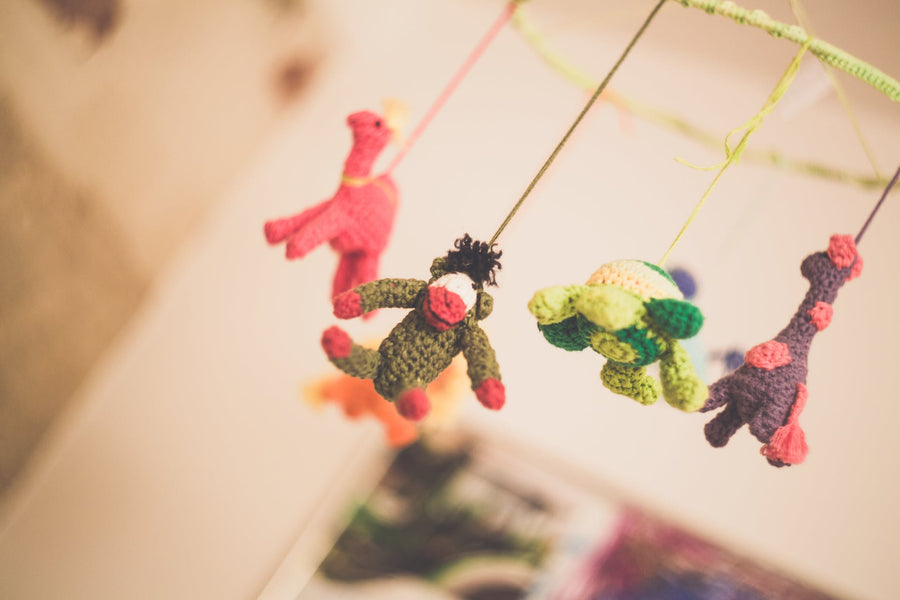 Colorful mobile shaped as animals dangles
