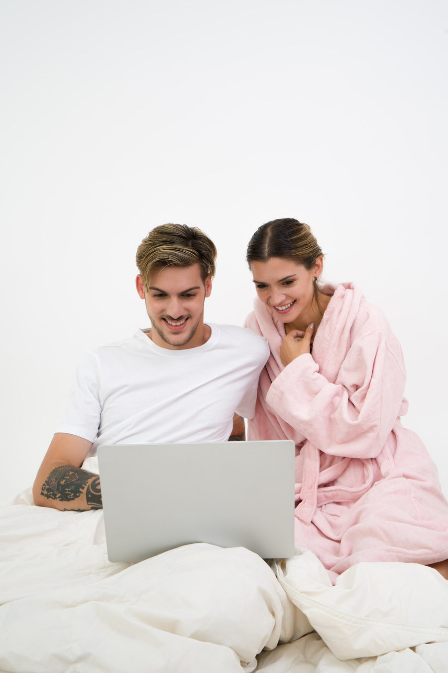 man and woman looking at a laptop 