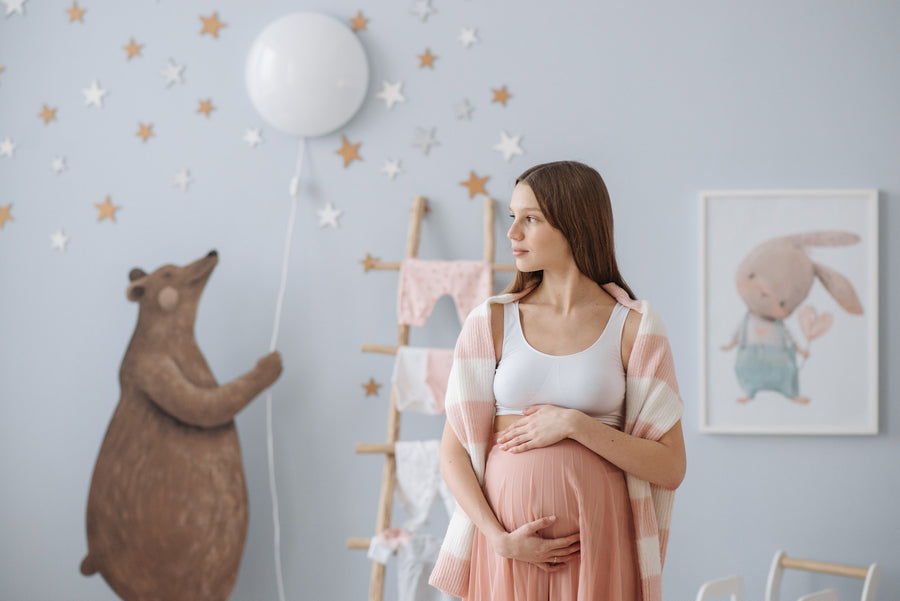 pregnant women in her baby’s room