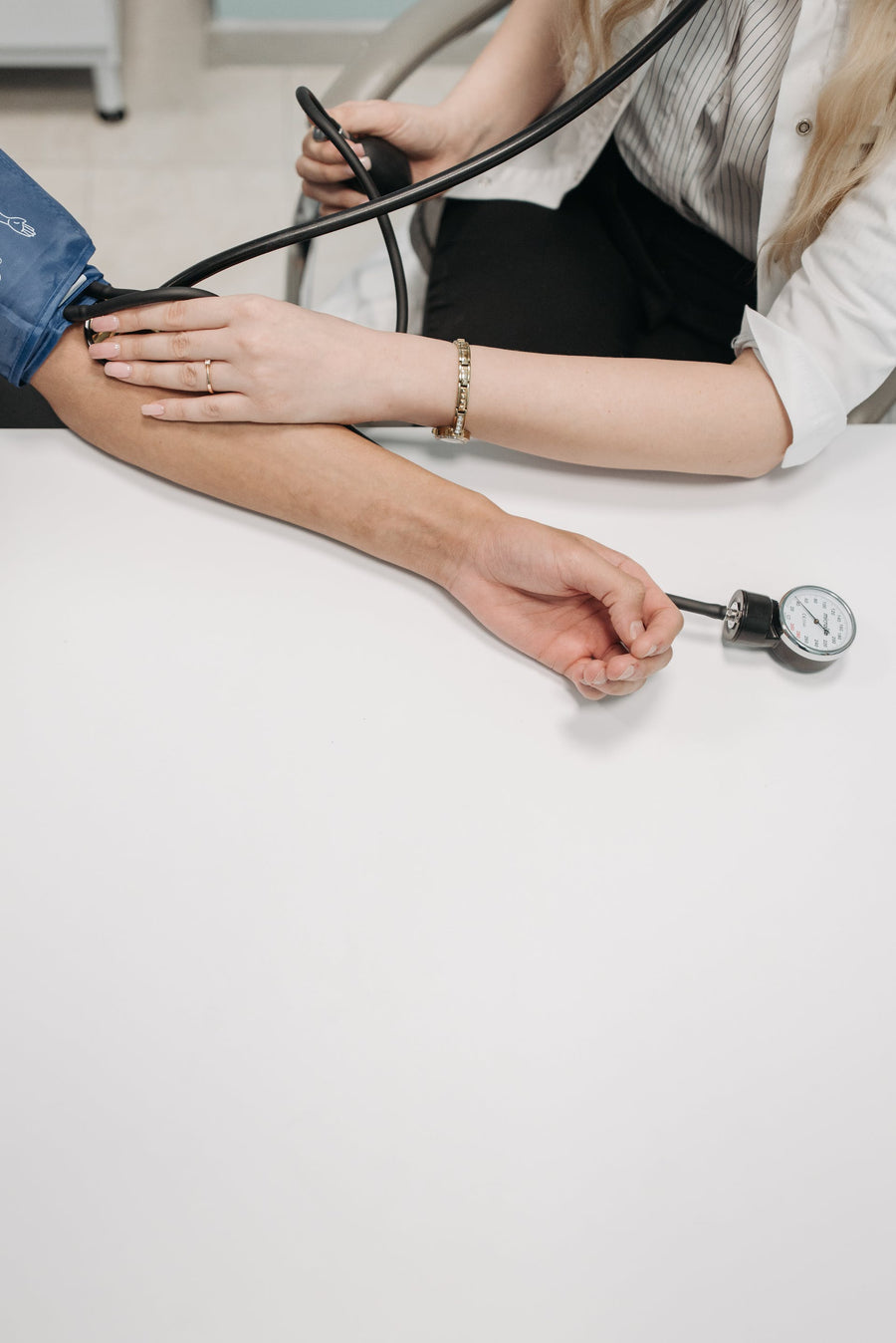 woman getting a blood pressure test