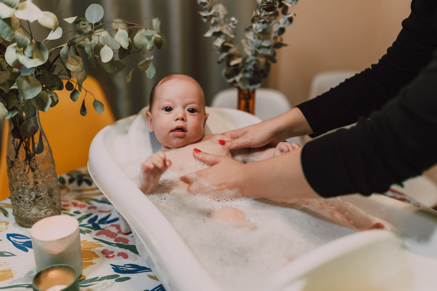  a baby getting a bath