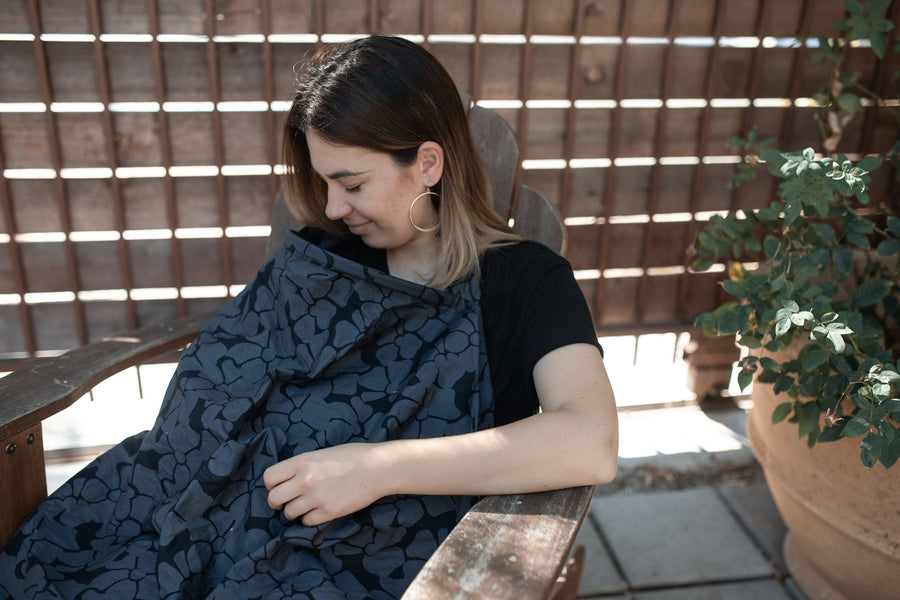 mother breastfeeding with nursing cover