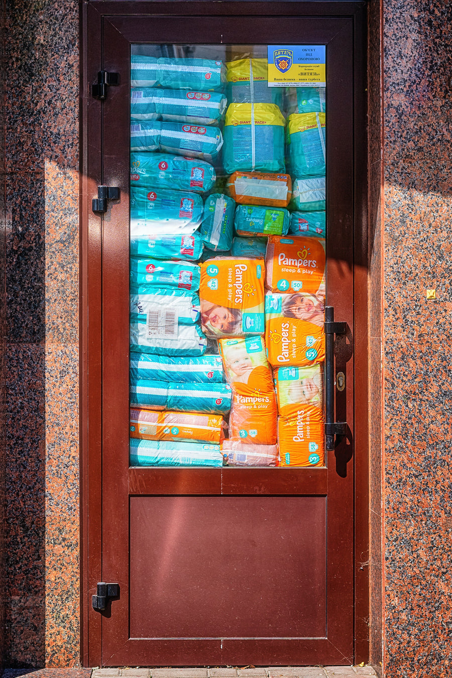 cabinet full of Pampers diapers