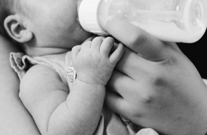 Baby drinking a bottle