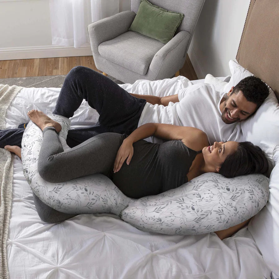 Pregnant couple with pillow