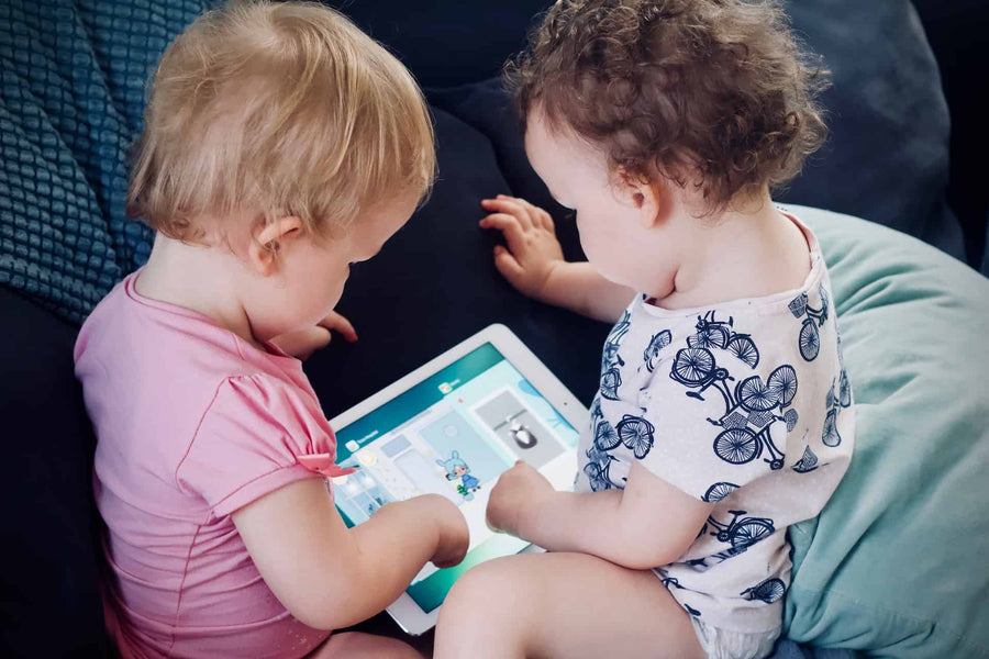 two babies playing a game