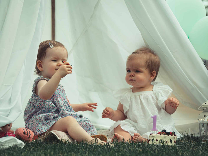 two babies playing together